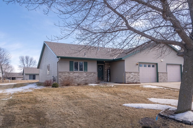 ranch-style house with a garage, concrete driveway, brick siding, and roof with shingles