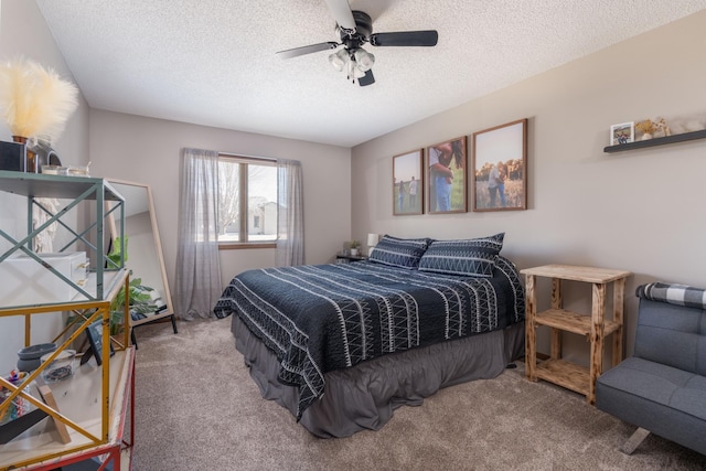 bedroom featuring carpet floors, a ceiling fan, and a textured ceiling