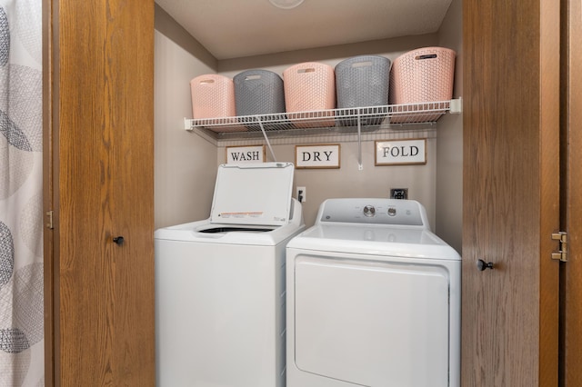 laundry area with laundry area and separate washer and dryer