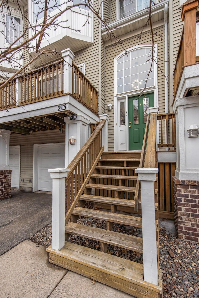 entrance to property with aphalt driveway