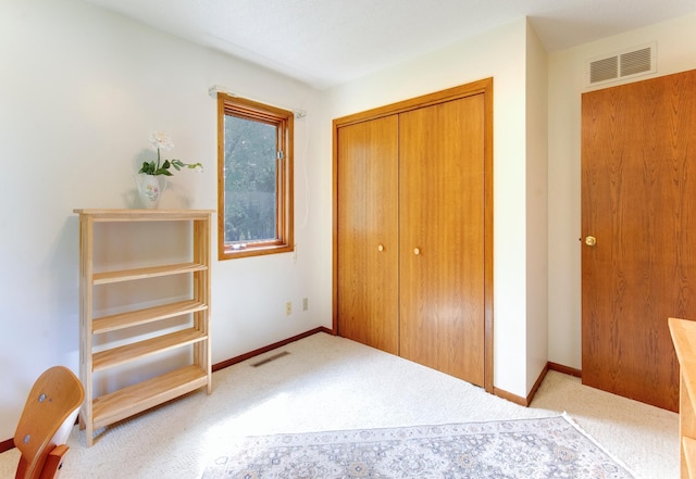 unfurnished bedroom featuring a closet, visible vents, and baseboards