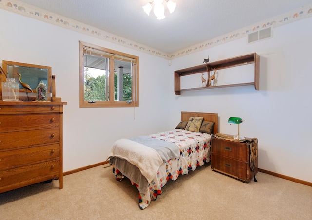 bedroom with carpet flooring, visible vents, and baseboards