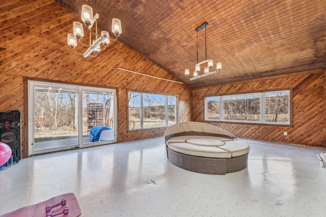 unfurnished room with wooden walls, speckled floor, wooden ceiling, and a notable chandelier