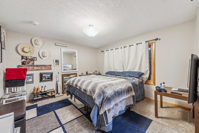 bedroom featuring a textured ceiling and baseboards