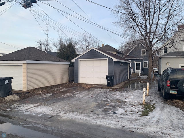 detached garage featuring driveway