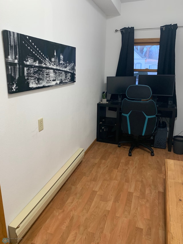 home office featuring light wood-style floors and baseboard heating