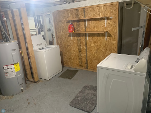 washroom with washer / clothes dryer, water heater, and laundry area