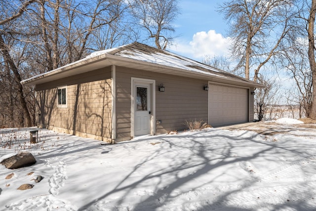 view of snow covered garage