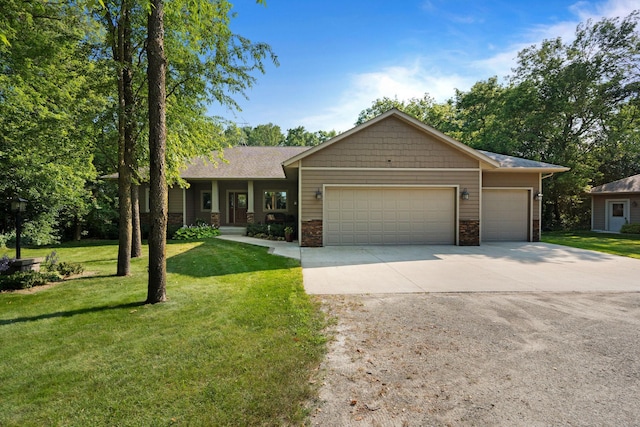 ranch-style house with a garage, a front yard, concrete driveway, and stone siding