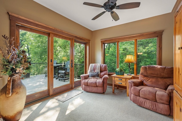 sunroom / solarium featuring ceiling fan