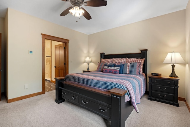 bedroom featuring baseboards, a ceiling fan, and light colored carpet