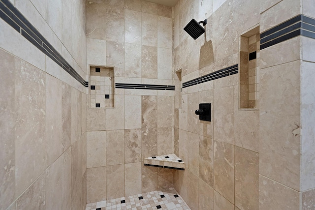 full bath with tiled shower