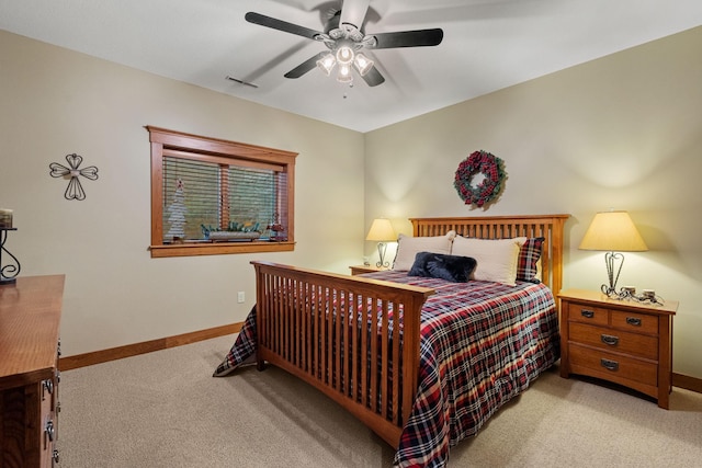 bedroom featuring a ceiling fan, carpet, visible vents, and baseboards