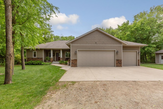 10060 82nd Ave, Ellendale, MN 56026 - view of front facade with an attached garage, concrete driveway, a front lawn, and stone siding
