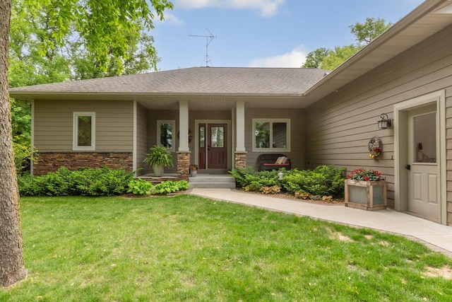 10060 82nd Ave, Ellendale, MN 56026 - view of front facade with a front lawn, a shingled roof, and covered porch