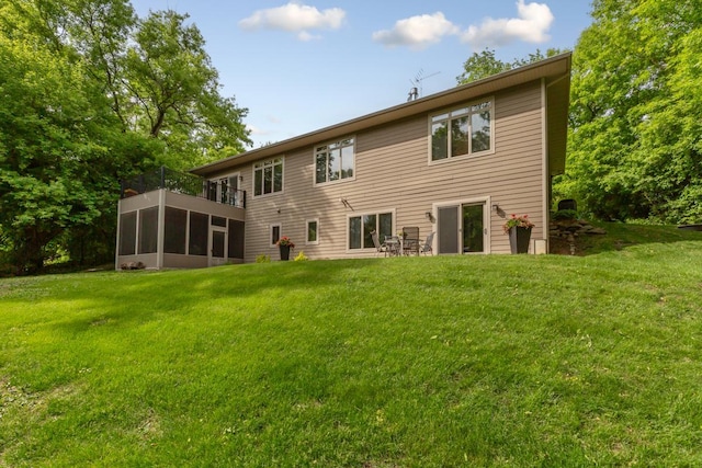 10060 82nd Ave, Ellendale, MN 56026 - rear view of house with a yard, a balcony, and a sunroom
