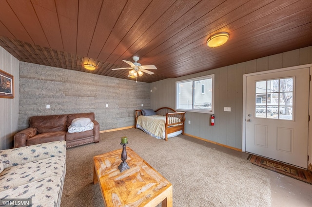 bedroom featuring wood ceiling and baseboards