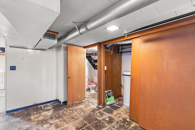 finished basement with visible vents and tile patterned floors