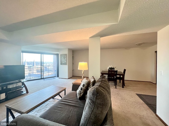 living room with a textured ceiling and light carpet