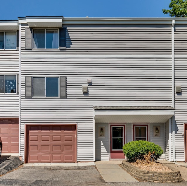 multi unit property featuring an attached garage