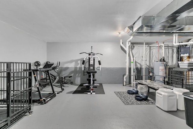 exercise room featuring gas water heater