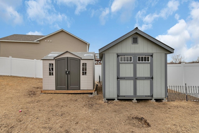 view of shed with a fenced backyard