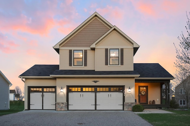5108 Harvest Curv, Mayer, MN 55360 - view of front of home with covered porch, a garage, stone siding, and aphalt driveway