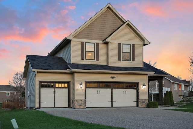 5108 Harvest Curv, Mayer, MN 55360 - view of front of home featuring an attached garage, stone siding, and gravel driveway