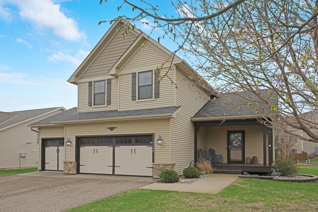 5108 Harvest Curv, Mayer, MN 55360 - view of front of property featuring covered porch, a garage, stone siding, and aphalt driveway