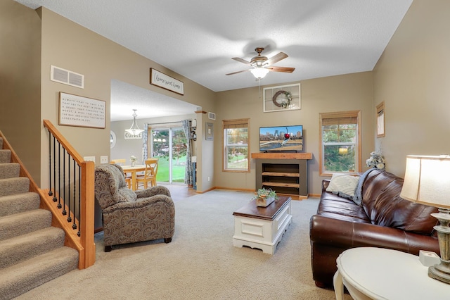 5108 Harvest Curv, Mayer, MN 55360 - carpeted living room featuring ceiling fan, visible vents, a healthy amount of sunlight, and stairway
