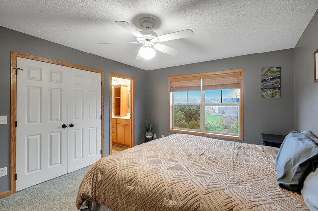 5108 Harvest Curv, Mayer, MN 55360 - bedroom featuring a closet, ensuite bathroom, a textured ceiling, a ceiling fan, and carpet