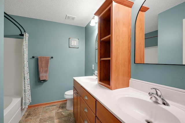 5108 Harvest Curv, Mayer, MN 55360 - full bathroom featuring toilet, a textured ceiling, visible vents, and a sink