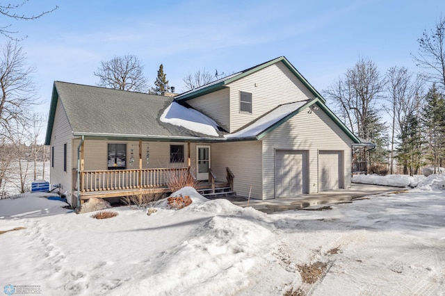 view of front of home featuring a garage and covered porch