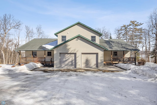 snow covered property featuring a porch