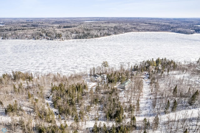 birds eye view of property with a wooded view