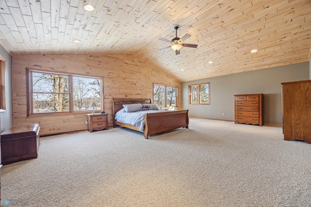 unfurnished bedroom with wooden ceiling, ceiling fan, carpet, wood walls, and high vaulted ceiling