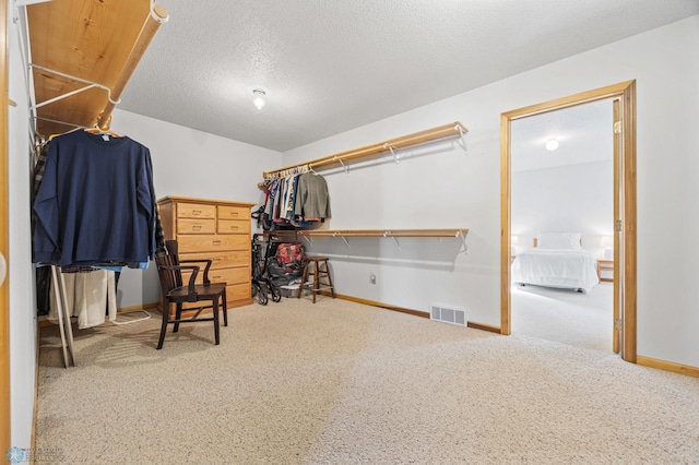 spacious closet featuring carpet floors and visible vents