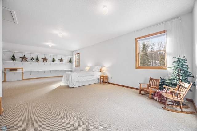 carpeted bedroom with a textured ceiling, multiple windows, and baseboards