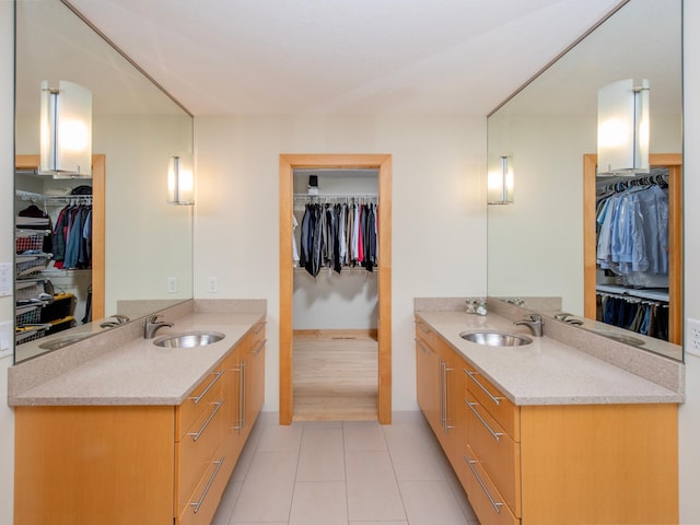 bathroom featuring two vanities and a sink