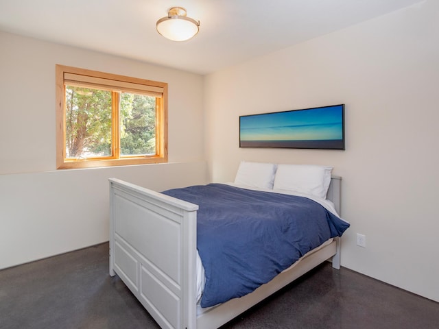 bedroom with finished concrete floors