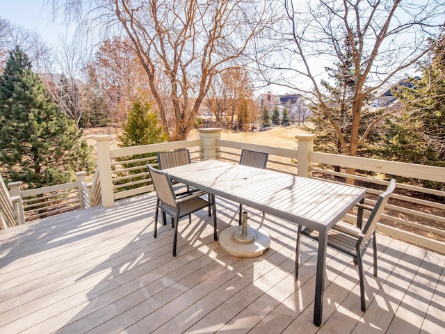 wooden deck featuring outdoor dining area