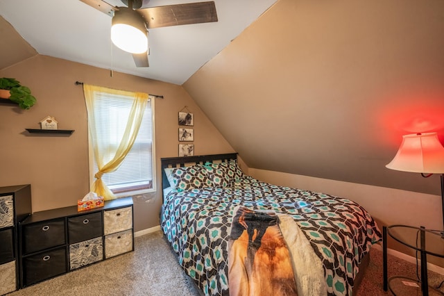 carpeted bedroom with ceiling fan, baseboards, and vaulted ceiling