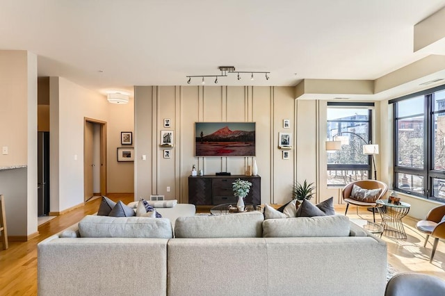 living room featuring track lighting and light wood-type flooring