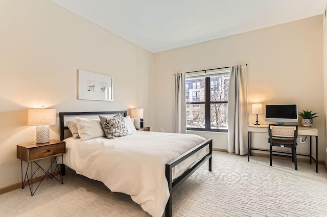 bedroom with baseboards and carpet floors