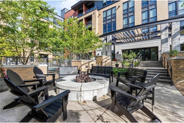 view of patio / terrace with a fire pit