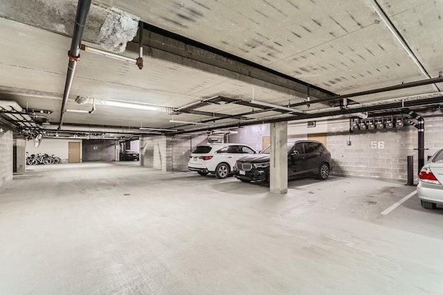 parking deck featuring concrete block wall