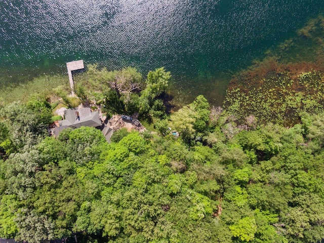 drone / aerial view featuring a wooded view