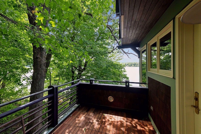 wooden deck with a water view