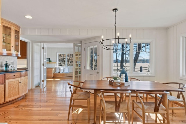 dining area featuring a chandelier and light wood finished floors