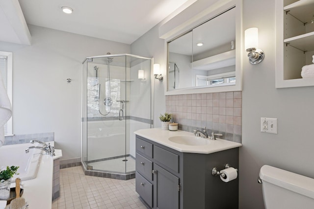 full bath with toilet, a stall shower, tasteful backsplash, and a garden tub